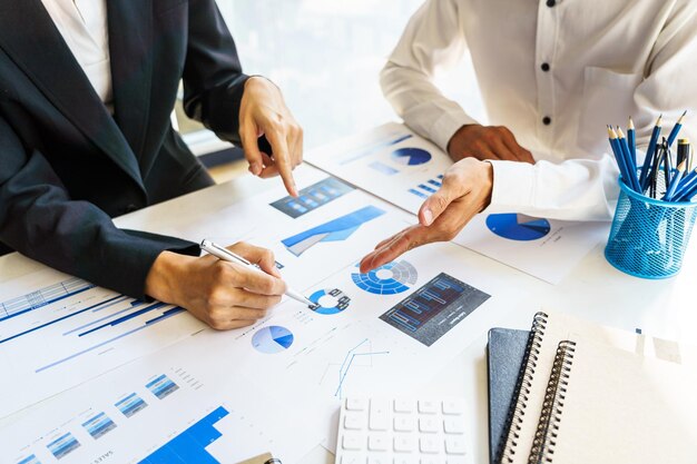 business colleagues discussing graph paperwork ideas at desk 35675 1674